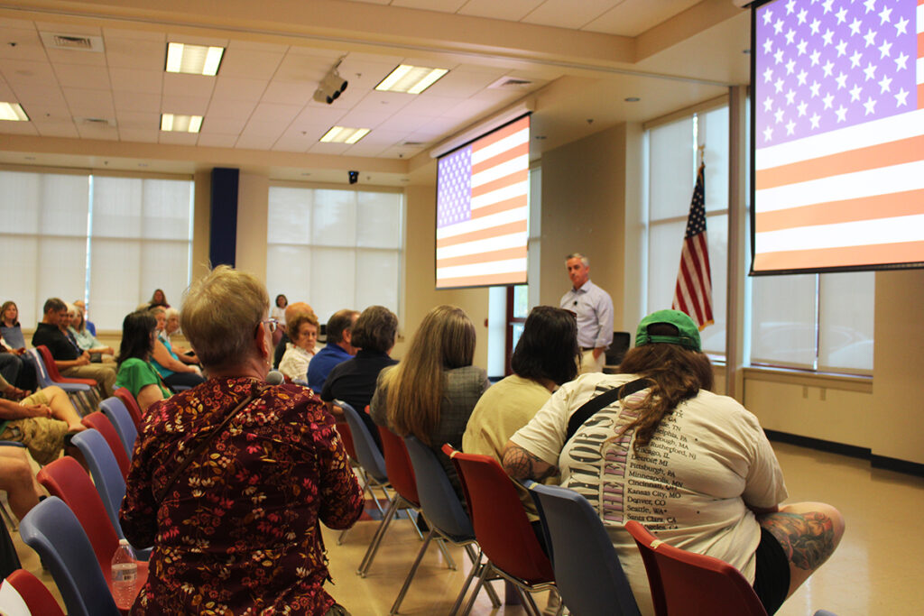 Bob Harvie answers questions from attendees at a Horsham town hall
