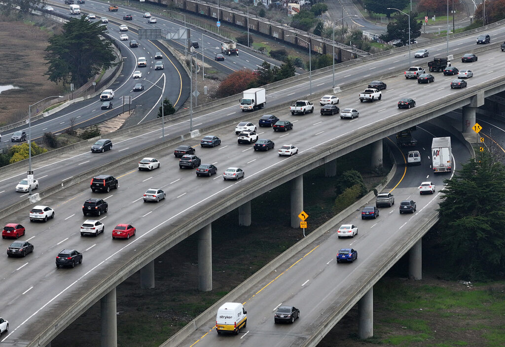 U.S. Carbon Emissions Dropped Nearly Two Percent In 2023 Cars travel on a interstate highway in California