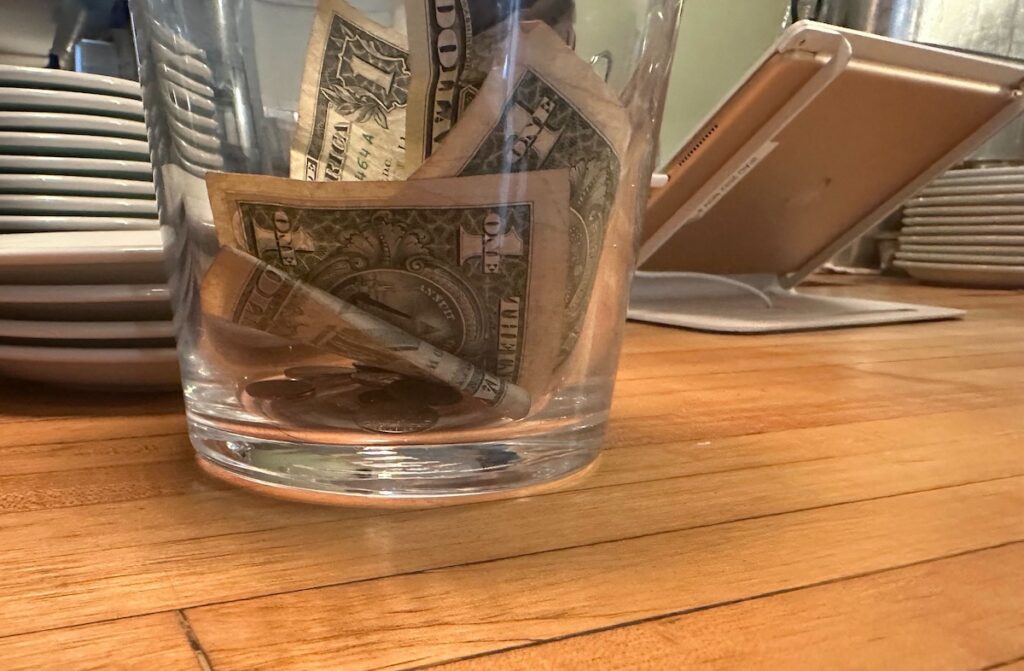 Cash tips in a jar