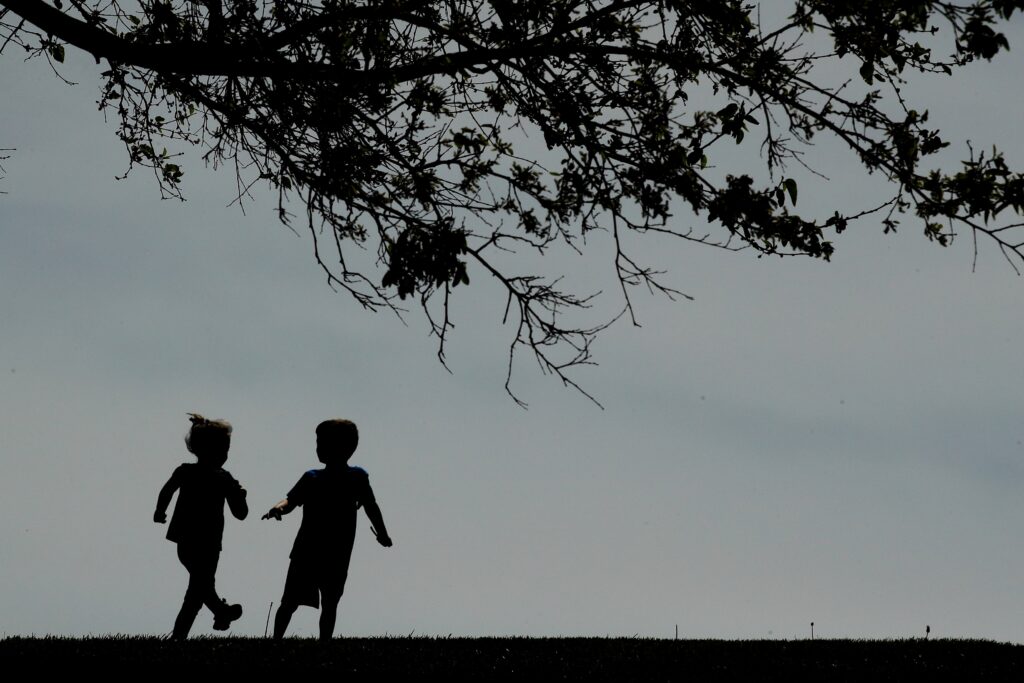 children-running-file-ap Children run on a lawn