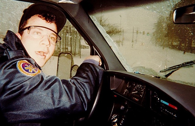 A man behind the wheel, while driving a vehicle