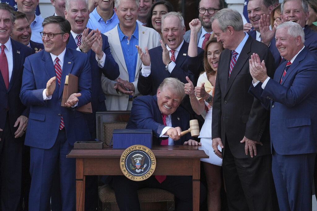 APTOPIX Trump Congress Tax Cuts Donald Trump signs his spending bill in front of Republican legislators