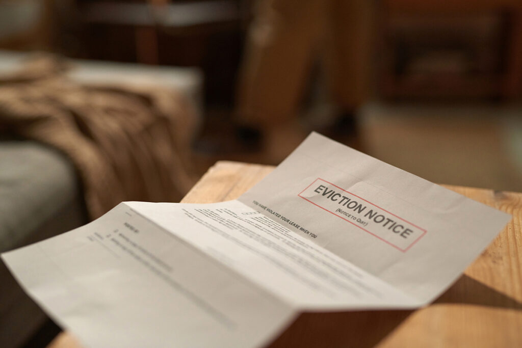 Room Eviction Notice Placed On Wooden Desk A eviction notice paper sits on a table