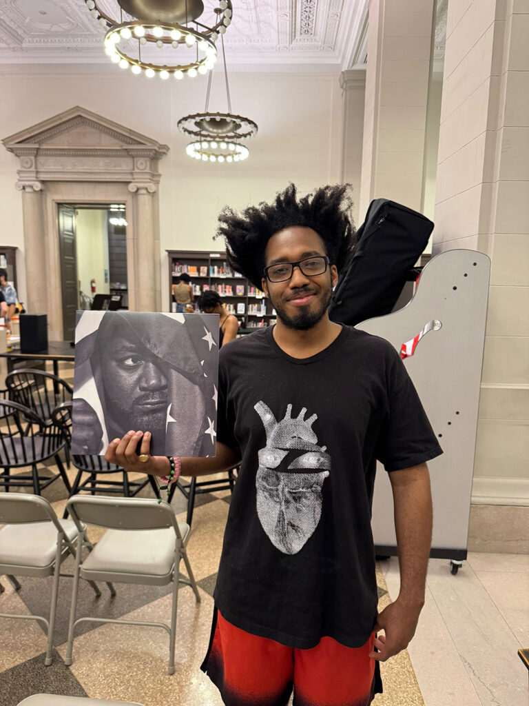A man holds his vinyl copy of "Sour Soul" by artist Ghostface Killah
