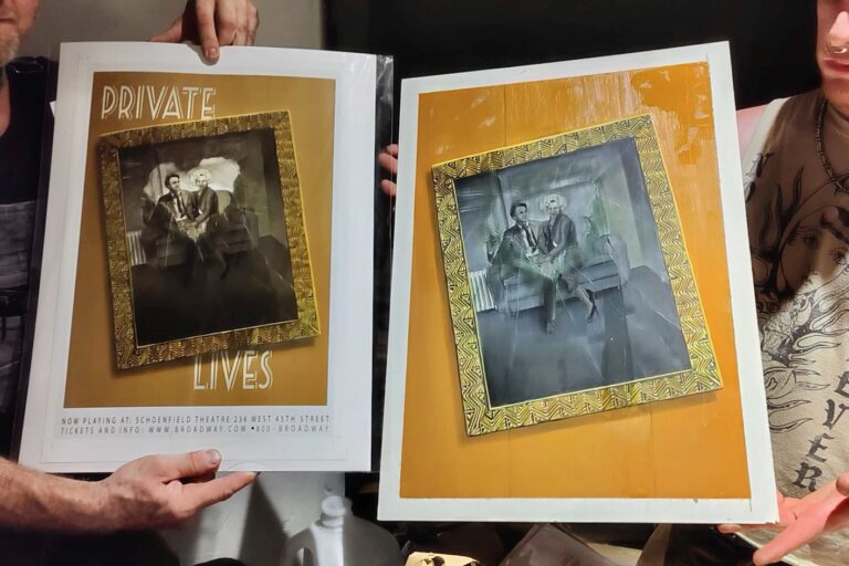 George Mathes (left) and Lucca Voltoio hold the original and print of a poster