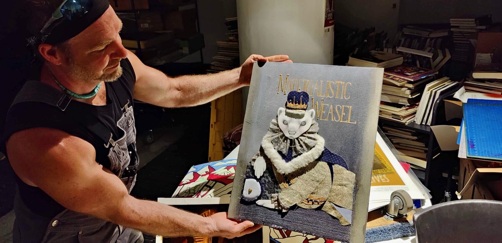 George Mathes of Thunderbird Salvage holds an original artwork