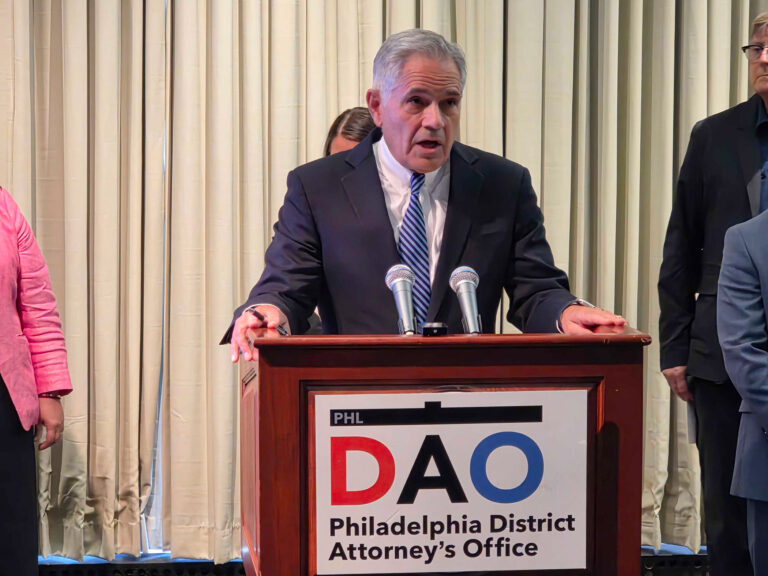 Larry Krasner speaking at a podium