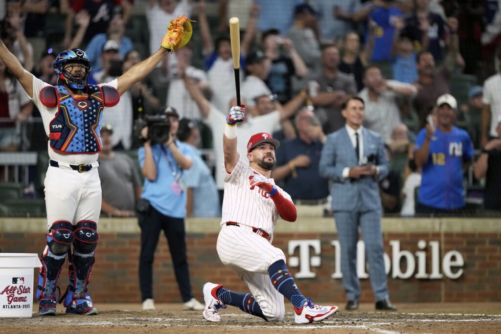 Philadelphia Phillies Kyle Schwarber celebrates after winning the tiebreaker at the MLB baseball All-Star game between the American League and National League, Tuesday, July 15, 2025, in Atlanta.