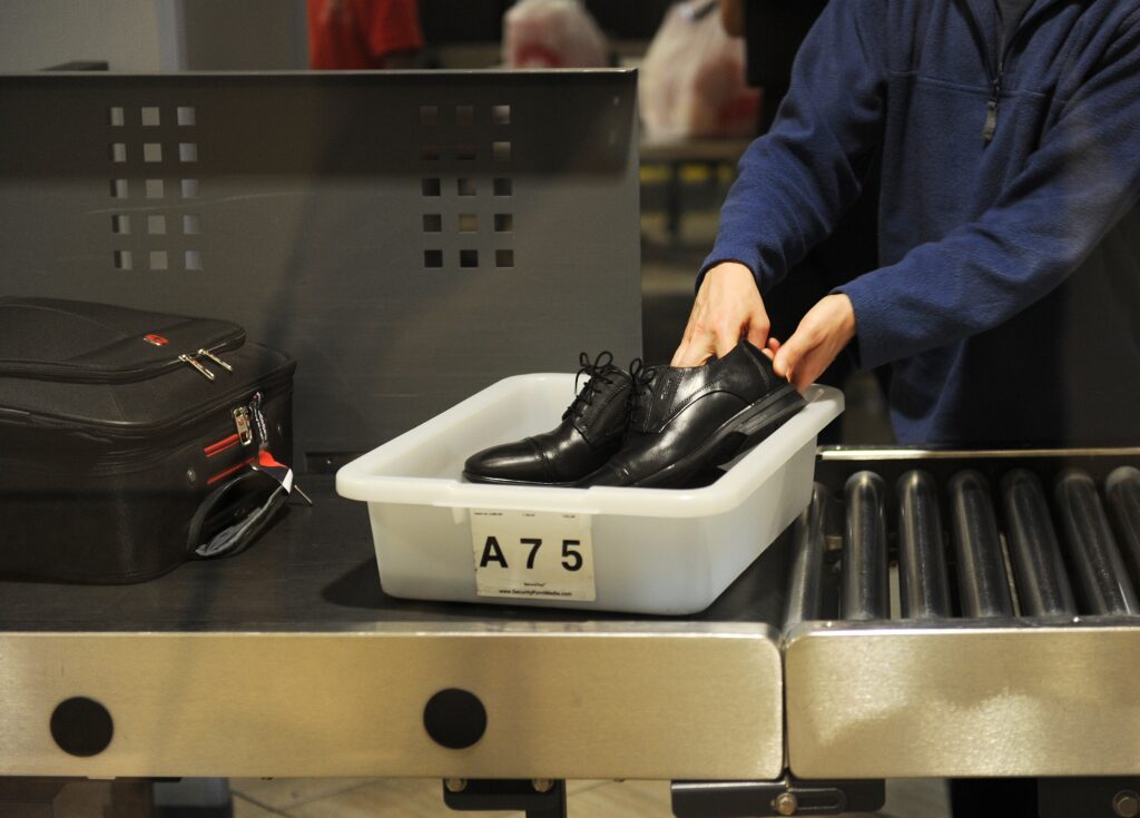 US-AIRLINE-HOMELAND SECURITY-TSA-LAX An air traveler puts their shoes in a bin at an airport security checkpoint