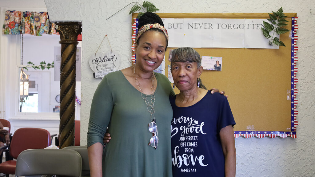 Janda (left) and Patricia Carter pose for a photo.