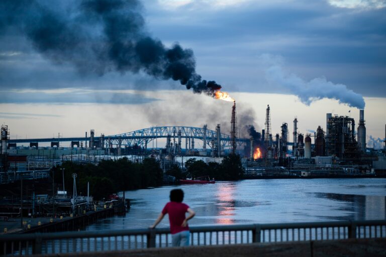 a child looks on at the Philadelphia Energy Solutions fire