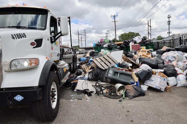 Trash overflows the dumpsters at the intersection of Snyder and Point Breeze avenues