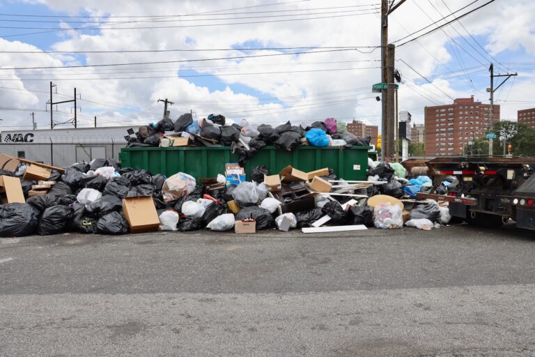 Trash overflows the dumpsters at the intersection of Snyder and Point Breeze avenues