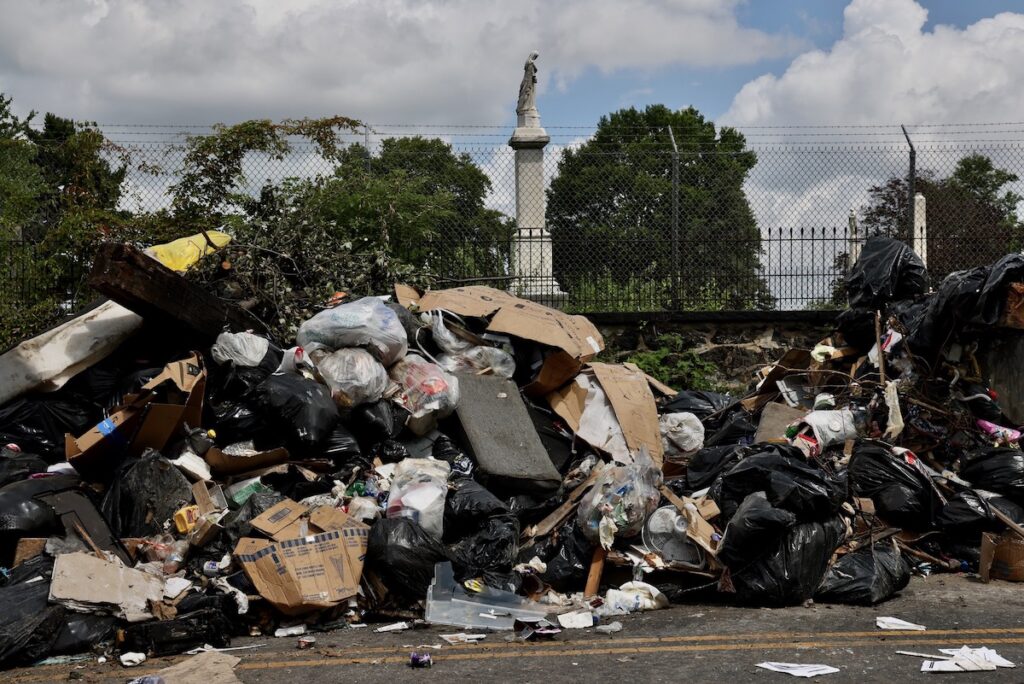 Trash piled up on Wyalusing Avenue near Cathedral Cemetery