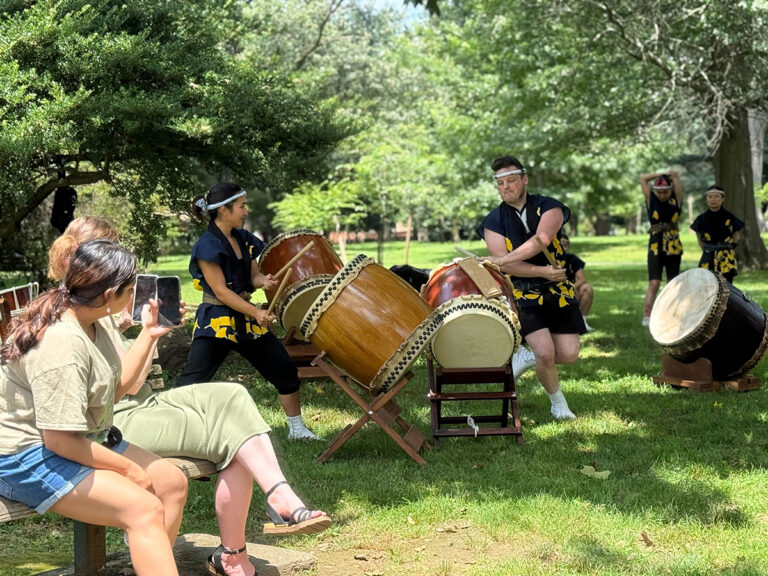 People watch a demonstration of taiko drumming