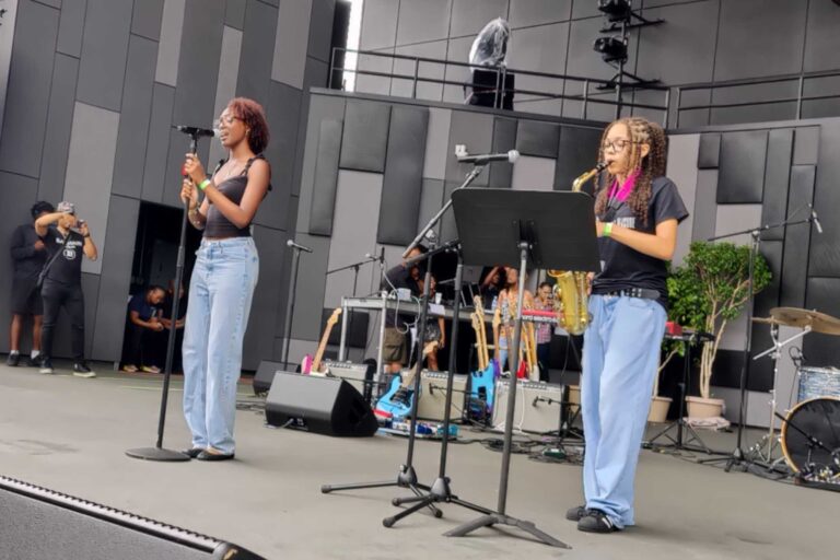 Two student performers onstage at Philly Youth Music Fest 2025