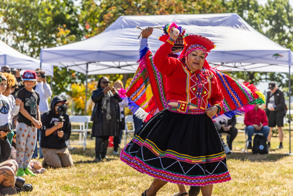 10-14-2024-k-paynter-Indigenous-peoples-day-24-11 A performer wearing traditional clothing performs at Indigenous Peoples' Day