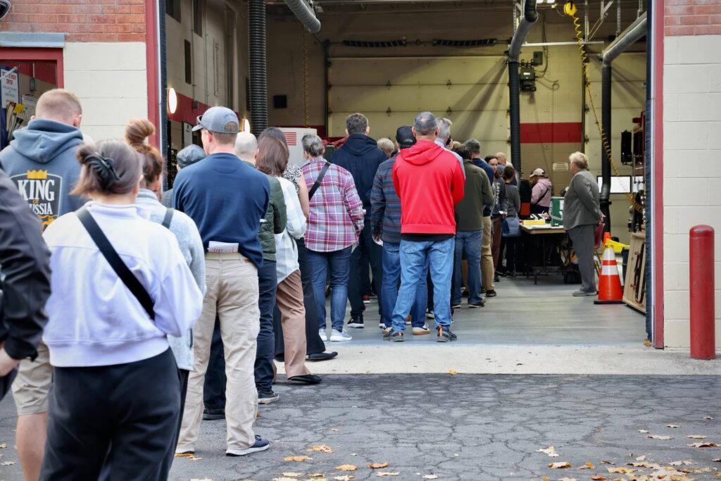 2024-11-05-e-lee-moorestown-nj-voting-lines-wide-file A line stretches out of the firehouse on Main Street in Moorestown Township, New Jersey