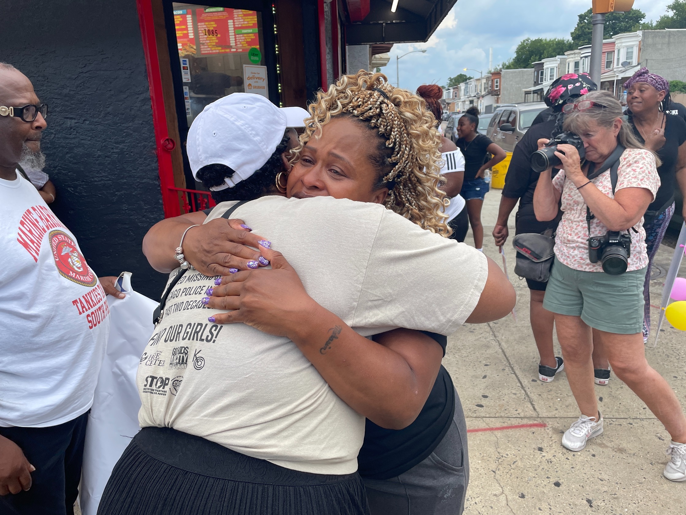 Ronsha A. Dickerson gives a hug to Mahasim Parker-Waheed, the mother of Esiyah Dixon-Waheed