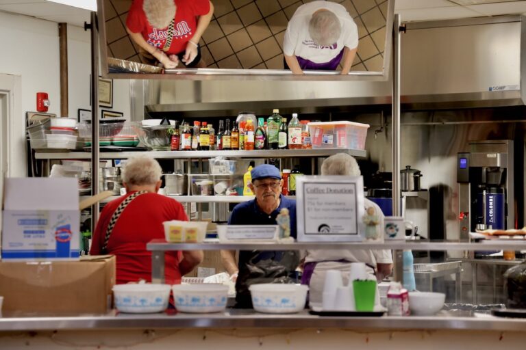 Volunteers prepare lunches in the Lutheran Settlement House