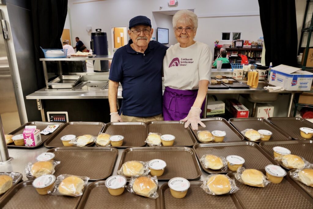 2025 08 14-e lee-thomas homer marge wible-philadelphia lutheran settlement house-thursday food pantry lunch Thomas Homer (left) and Marge Wible (right) volunteering at Lutheran Settlement House