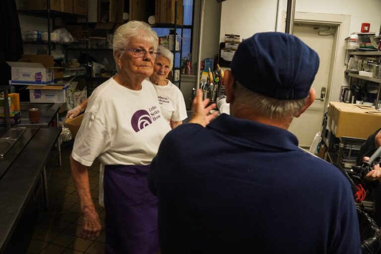 Marge Wible (left), Joan Creamer (center)and Thomas Homer working at Lutheran Settlement House