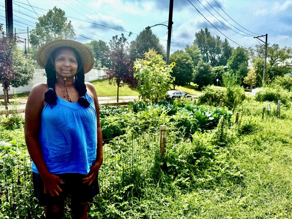 2025 08 14-z read-estelle vaughn-philadelphia nicetown tioga-phs greening tioga hope garden Estelle Vaughn posing for a photo in the garden