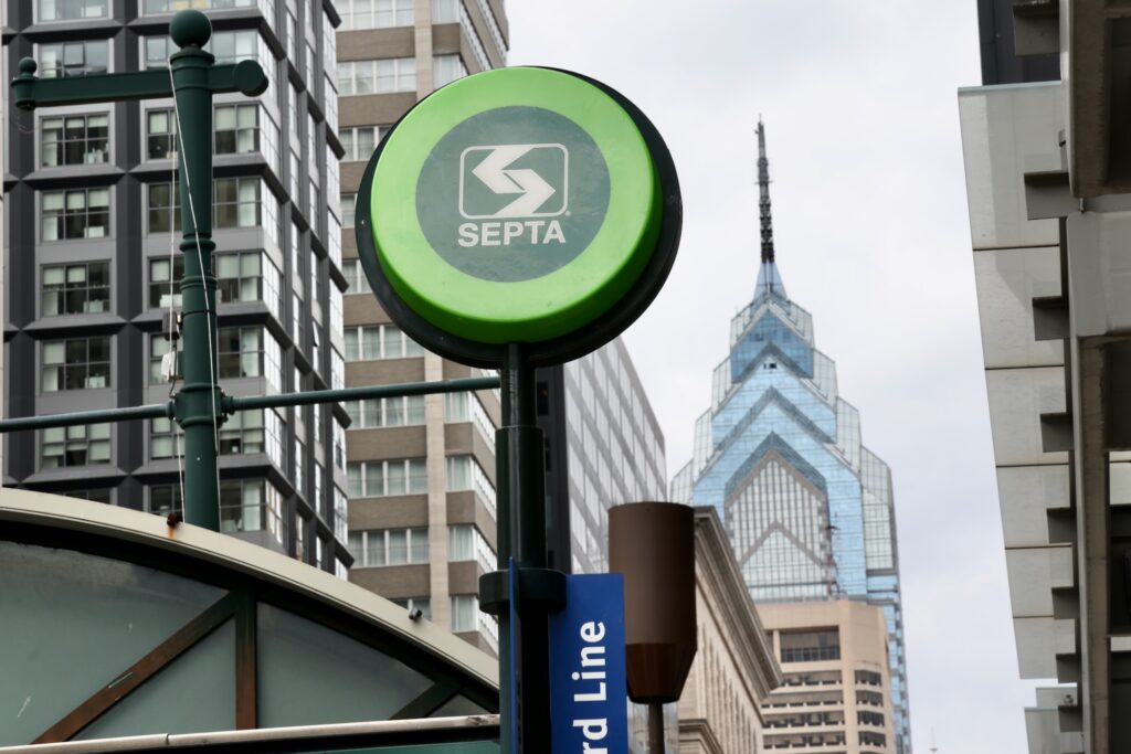 A SEPTA sign is seen above an entrance from the street to the subway station