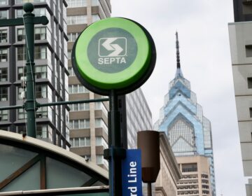 A SEPTA sign is seen above an entrance from the street to the subway station