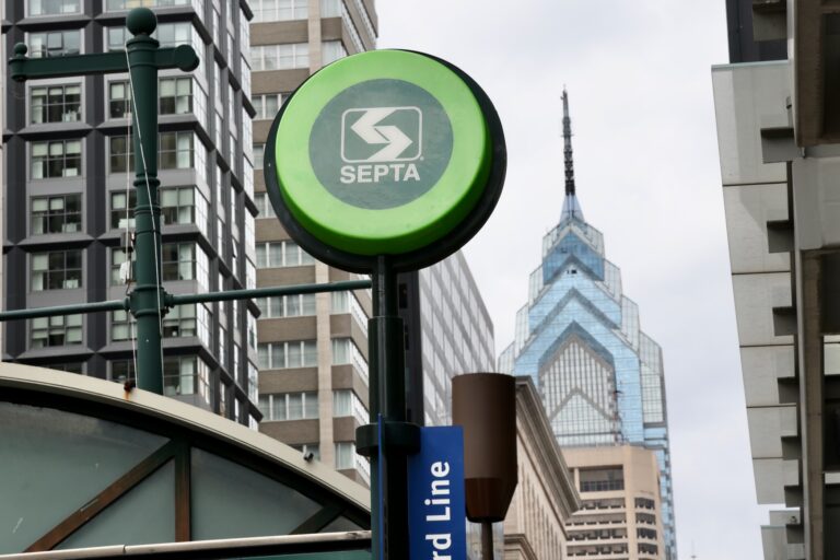 A SEPTA sign is seen above an entrance from the street to the subway station