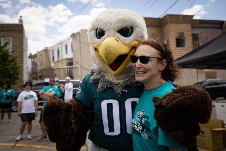 Jane Golden poses with eagles mascot