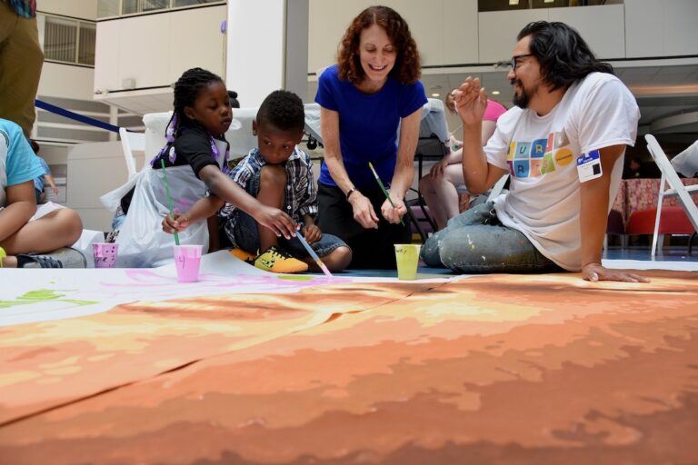 Jane Golden and Cesar Viveros painting Pope Francis mural in 2015
