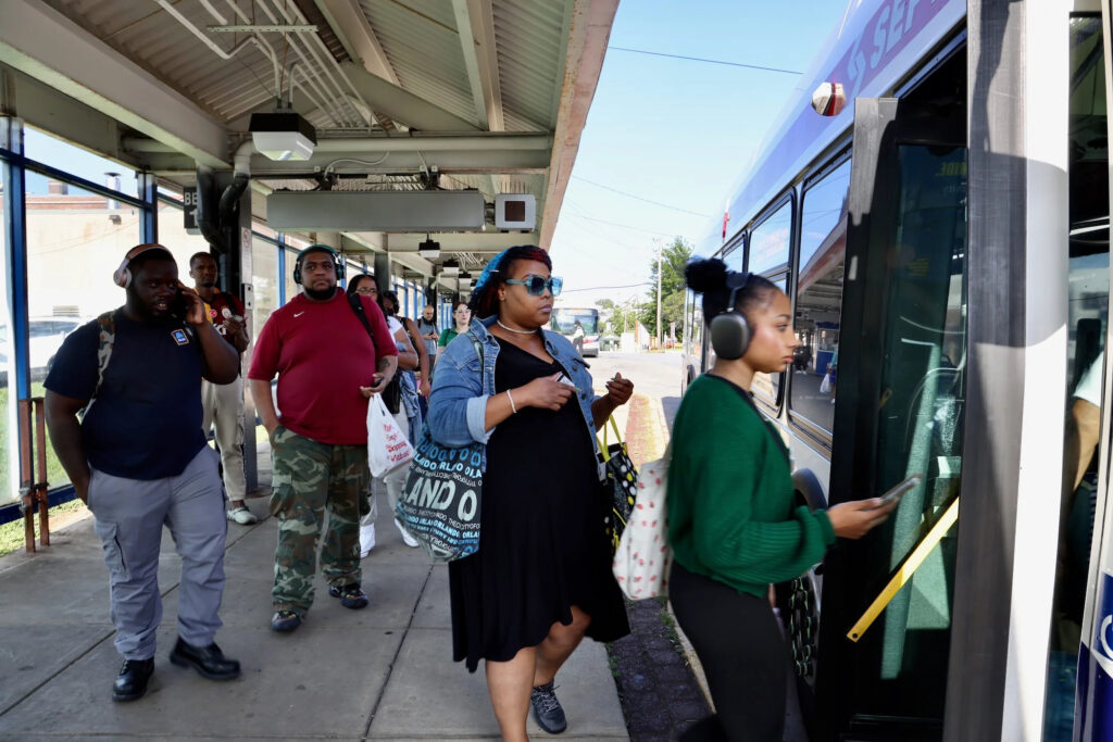 2025-08-25-e-lee-shakira-moore-philadelphia-69th-street-station-103-bus-boarding-file A group of people line up to get onto a SEPTA bus