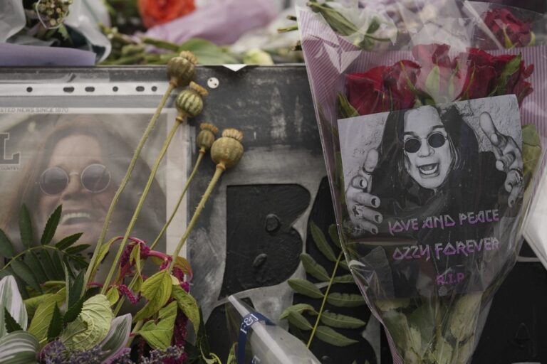 Flowers and messages are left by fans to commemorate the death of Ozzy Osbourne