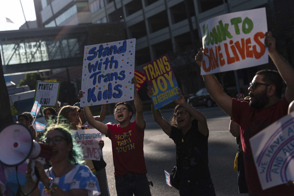 US Gender Affirming Care Protestors hold signs to demonstrate their support for transgender children