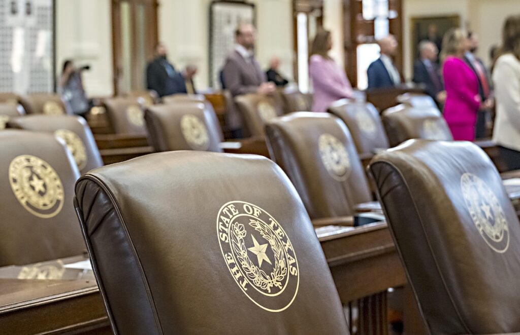 Texas Redistricting Empty chairs belonging to House Democrats remain empty during session convocation in the State Capitol, Tuesday, Aug. 5, 2025, in Austin, Texas. (AP Photo/Rodolfo Gonzalez)