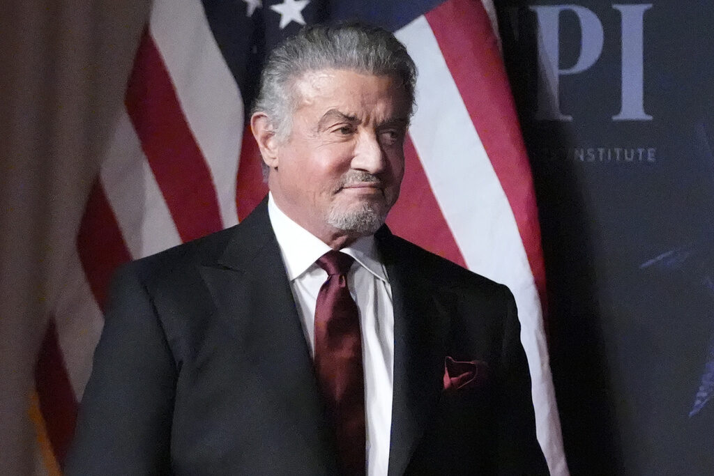 Sylvester Stallone wears a suit