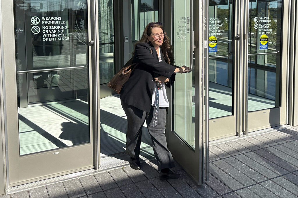 Heather Honey, a conservative election researcher, leaves the federal courthouse in Harrisburg