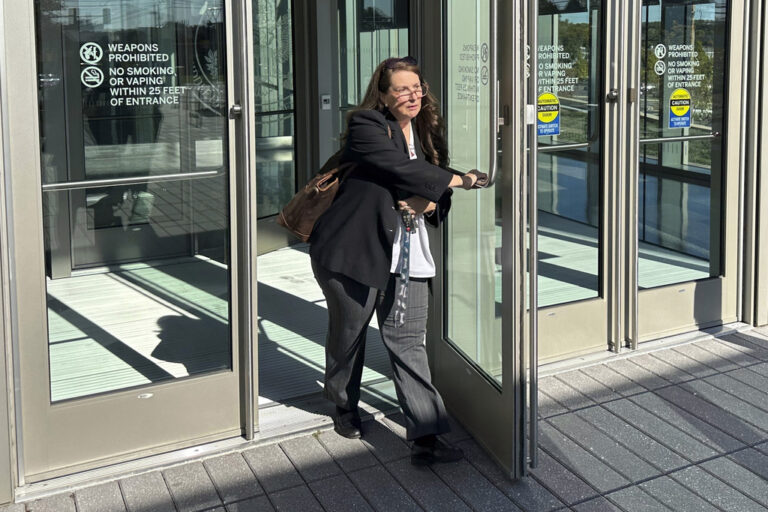 Heather Honey, a conservative election researcher, leaves the federal courthouse in Harrisburg