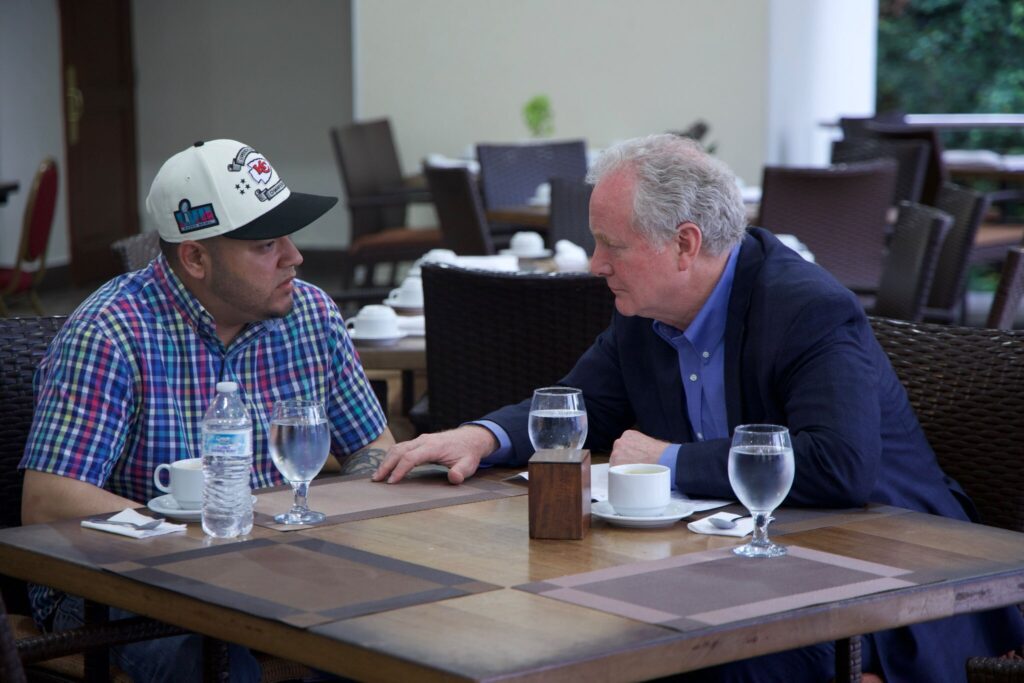 Senator Chris Van Hollen, right, sits with Kilmar Abrego Garcia — the Salvadorian citizen deported by the Trump administration — in El Salvador on April 17, 2025