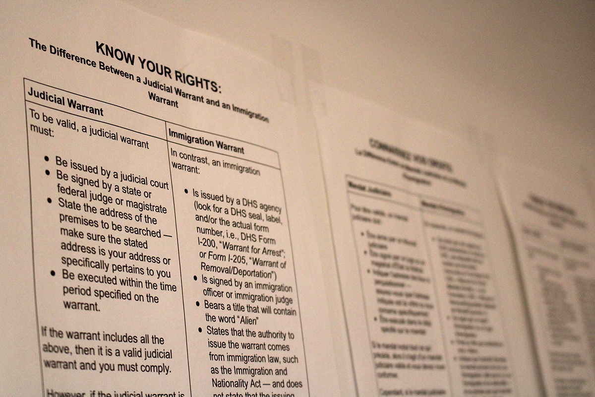 Display of Immigrant vs Judicial warrants displayed on a wall