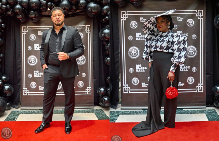 A man and woman in fancy clothes at a red carpet event