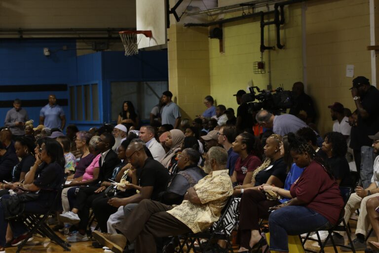 People sitting and standing in Christy Rec Center