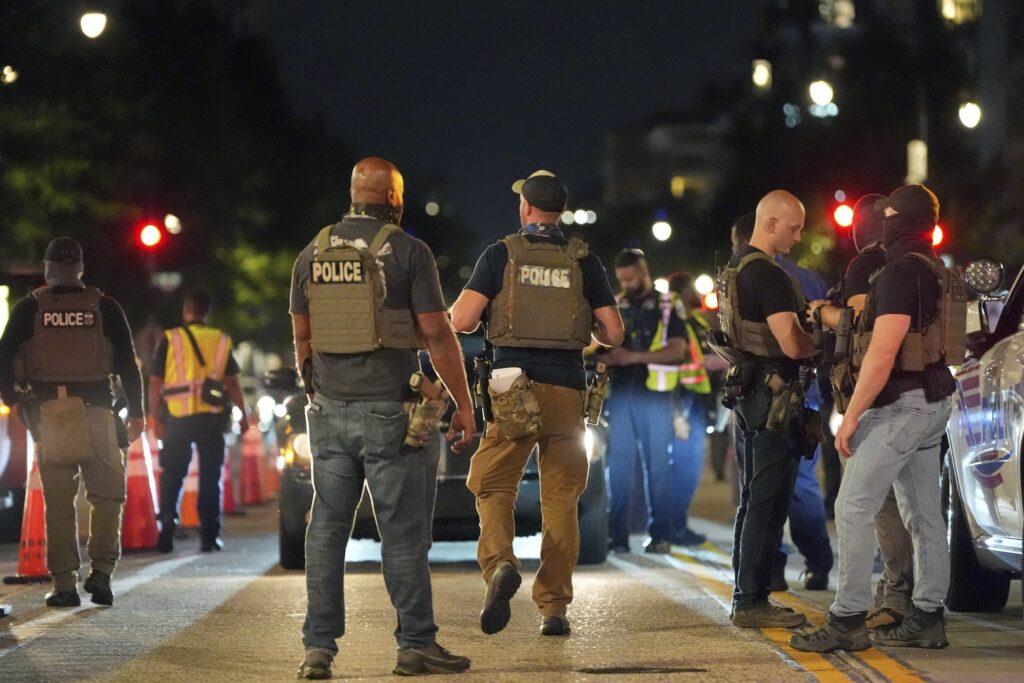 APTOPIX Trump District of Columbia Federal agents standing in the street with D.C. police