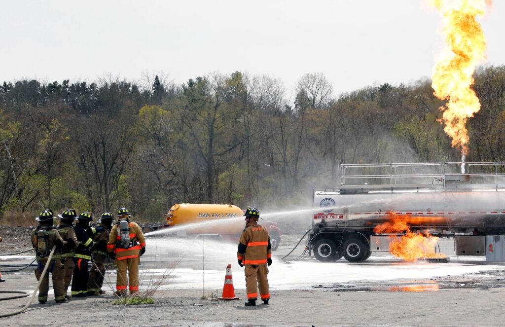 firefighting-foam-new-york-file-2014-ap Firefighters spray fire suppressant foam to douse flames on a tanker truck