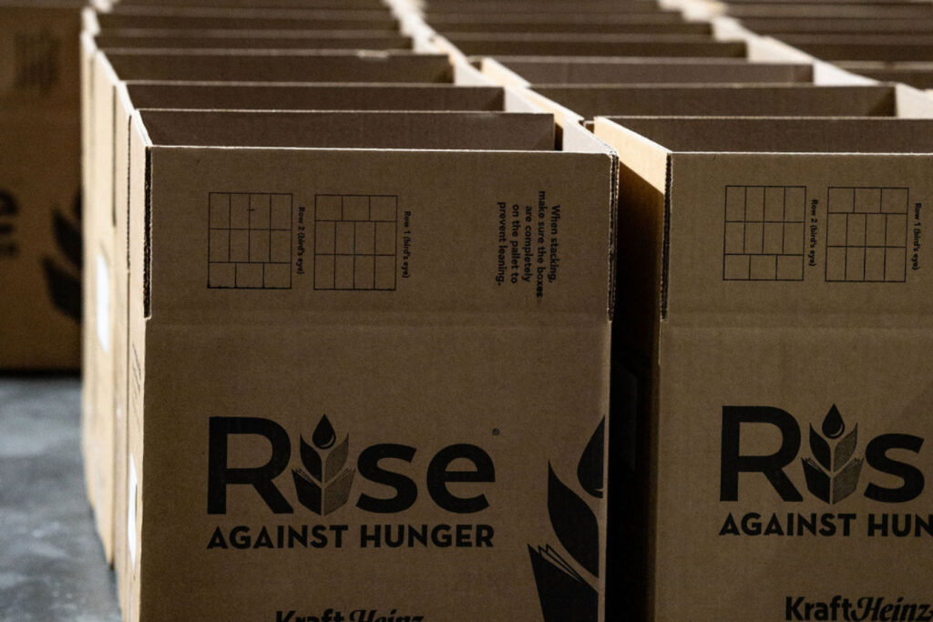 empty cardboard boxes read RISE AGAINST HUNGER KRAFT HEINZ