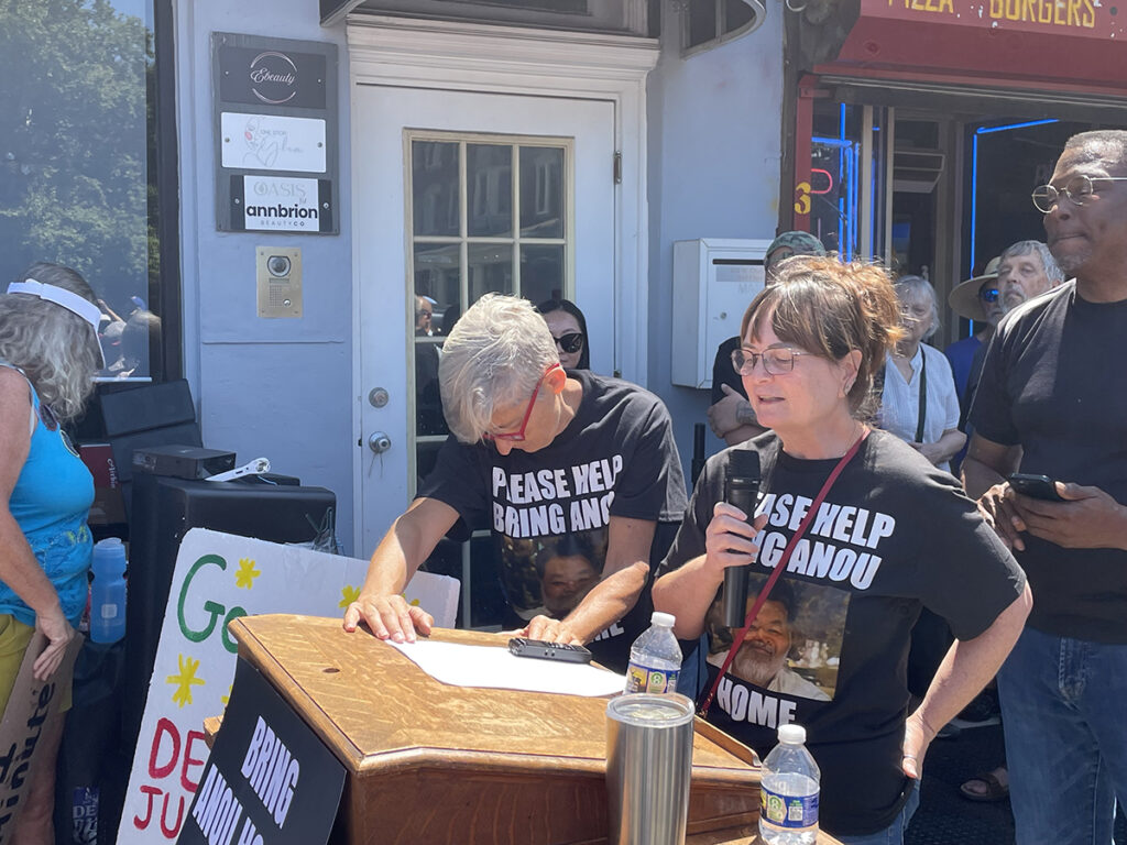germantown_cafe_owner_ice_rally3_08092025 A woman speaks at a rally on behalf of her husband, who is being detained by federal immigration officials