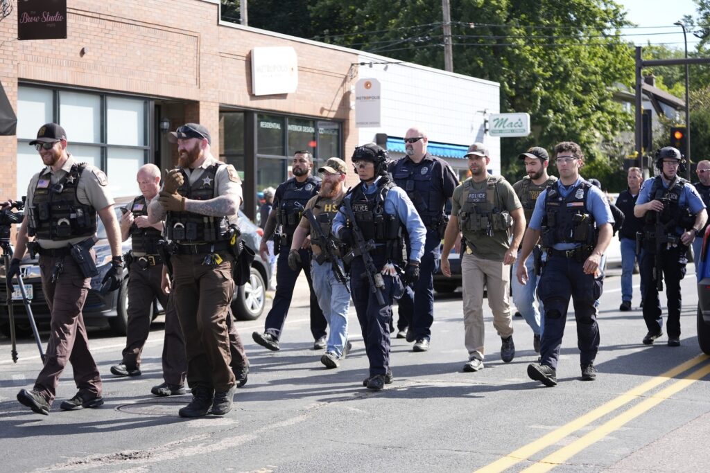 School Shooting Minneapolis Police approach the school where the shooting occured