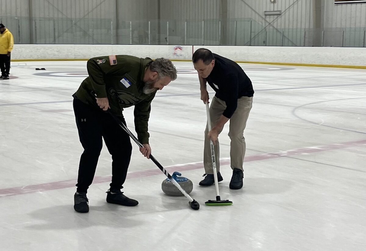 Beginner Curling players practicing