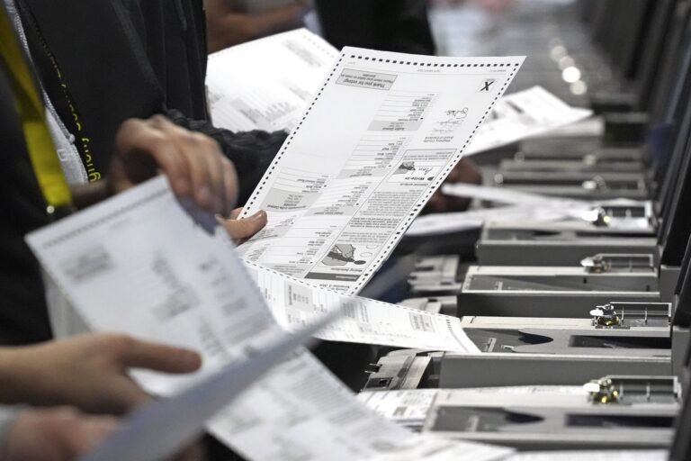 Election workers counting up ballots